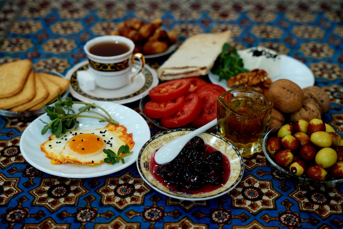 Egyptian breakfast spread with eggs, tea, tomatoes, and dates